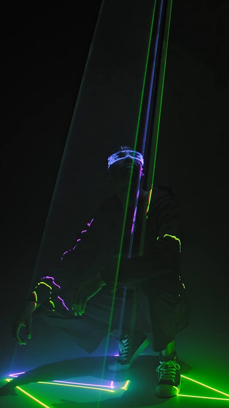 Posing under neon laser lights.