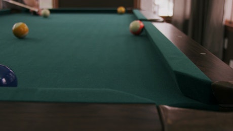 Potting stripes on a Pool table