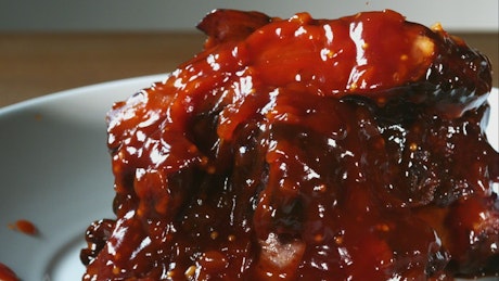 Pouring barbecue sauce in slow motion