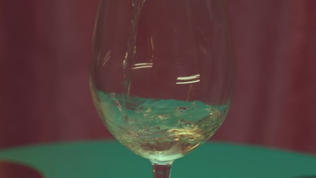 Pouring white wine.