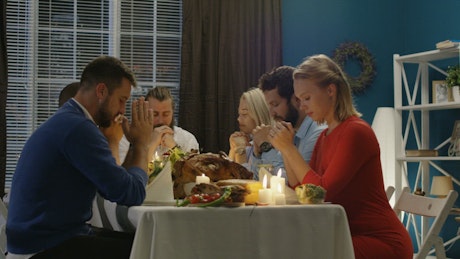 Praying on Thanksgiving celebration