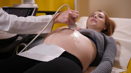 Pregnant woman having a scan.