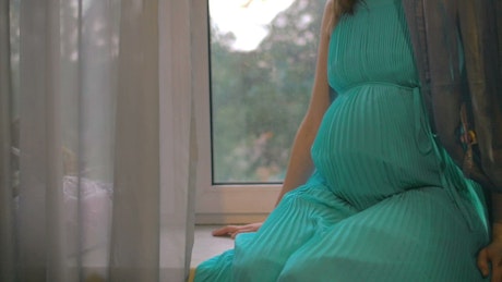 Pregnant woman in a dress.