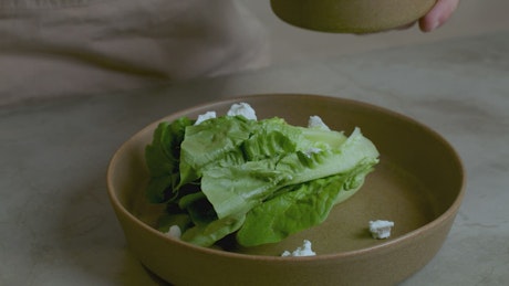 Preparing a salad with dressing