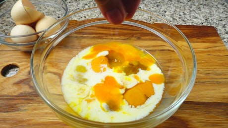 Preparing breakfast with eggs and milk