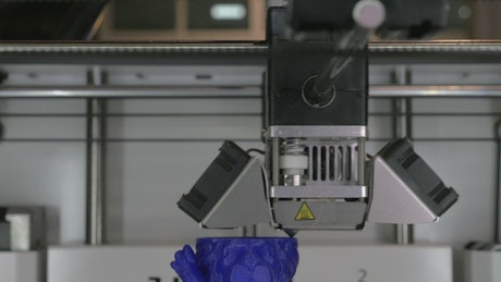 Printing a model with blue filament.
