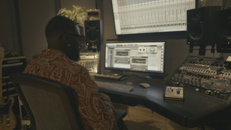 Producer working in a recording studio.