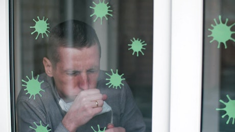 Quarantined man coughing at home
