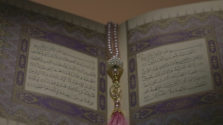 Quran resting on a plinth.