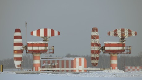 Radar at the edge of an airport.
