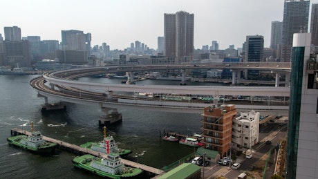 Rainbow Bridge with the city of Tokyo in the background.