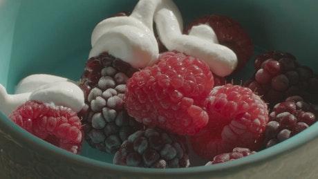 Raspberries with frozen cream