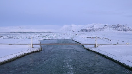 River with a bridge in a snowy area