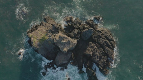Rock formations in the sea in a view from above.