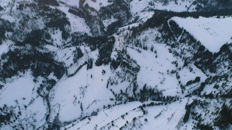 Rocky winter mountains in detail, aerial view.