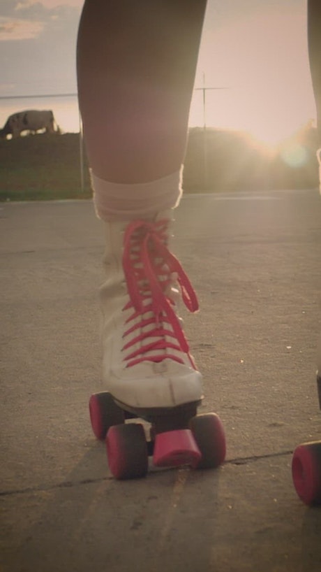 Roller skates of a girl when skating on the street.