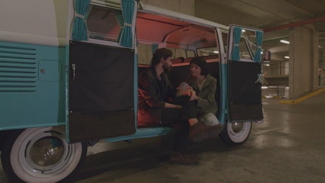 Romantic date in a van in a parking lot.