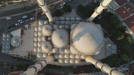 Roof of a mosque with many cupolas from above