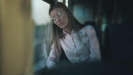 Sad woman traveling in a bus.