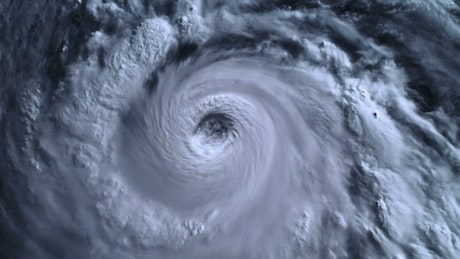 Satellite view of an angry hurricane growing.