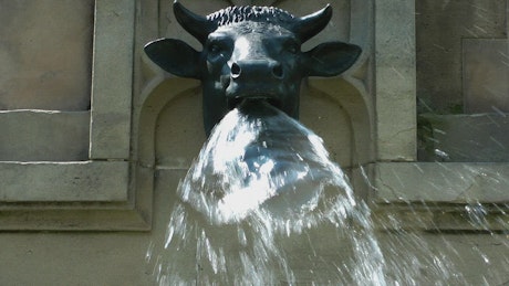Sculpture of a bull drawing water from its muzzle