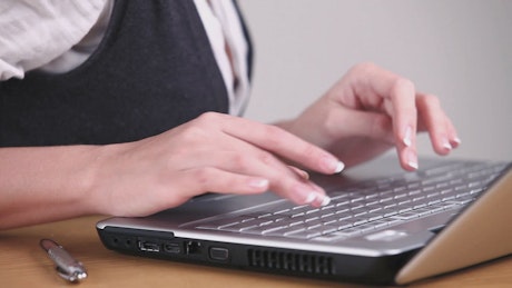 Secretary works on a laptop