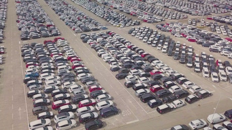 Seemingly endless view of a rental car park.