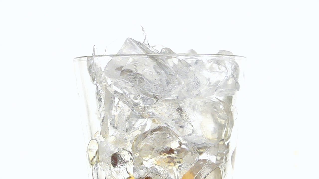 Serving soda in a glass with ice cubes on a white backgroun LIVE DRAW d