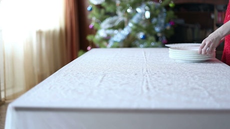 Setting a table for a festive Christmas feast.