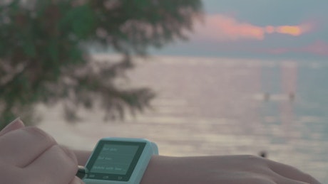Setting up a smartwatch at the beach