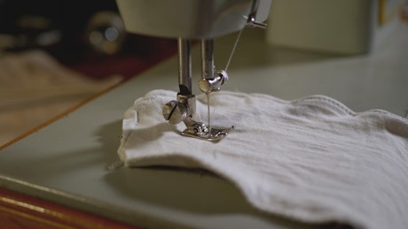 Sewing machine needle working in slow motion.