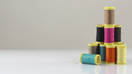 Sewing threads on white background