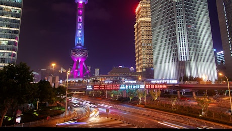 Shanghai city traffic and illuminated a tower