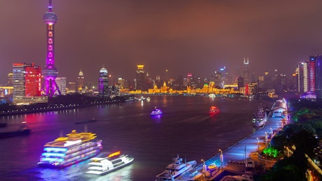 Shanghai river and illuminated city.