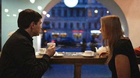 Sharing a coffee in the evening.