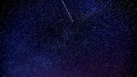 Shooting star in a night sky.