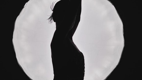 Silhouette of a ballet dancer spinning.