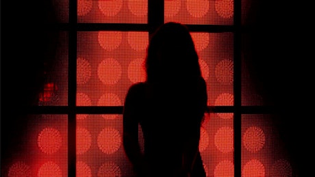 Silhouette of a girl dancing at a nightclub.