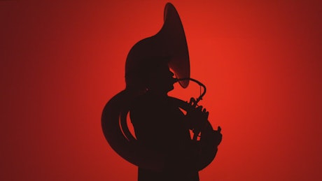 Silhouette of a musician playing the trombone