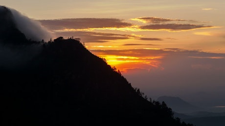 Silhouette of the mountain and the sunrise