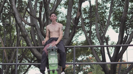 Skater with his skateboard, portrait.