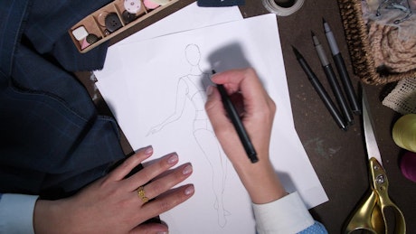 Sketching a dress.