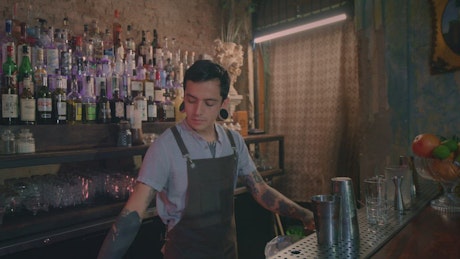 Skilled bartender preparing drinks at a bar