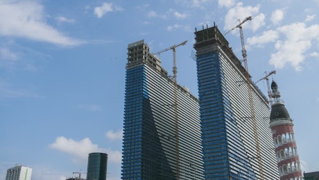 Skyscraper construction and cranes time lapse.