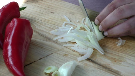 Slicing vegetables on a wooden board