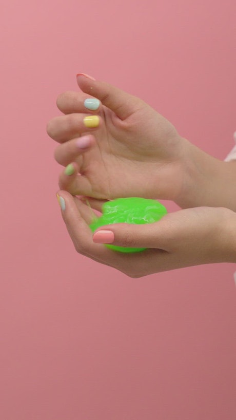 Slippery slime in the hands of a woman.