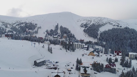 Small town on the slopes of the snowy mountains