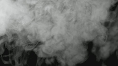 Smoke drifting in a dark room