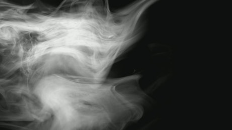 Smoke moving on a dark background.
