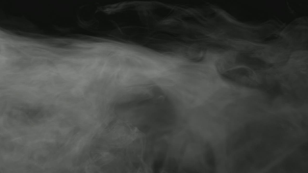 Smoke rising down in a black room - Free Stock Video